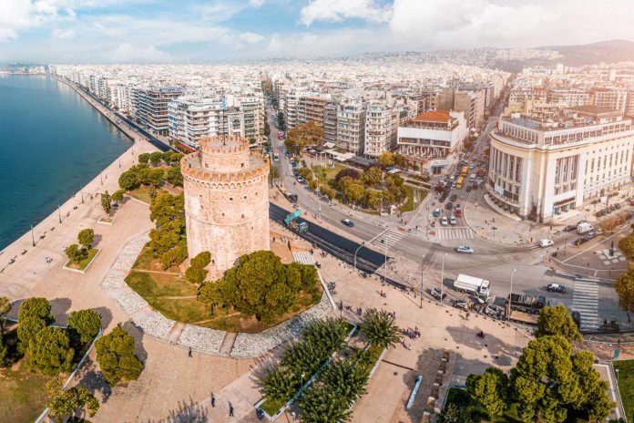 aerial panoramic view main symbol thessaloniki city whole macedonia region white tower with busy crossroad with cars public transport traffic