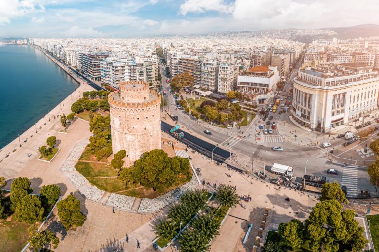 aerial panoramic view main symbol thessaloniki city whole macedonia region white tower with busy crossroad with cars public transport traffic